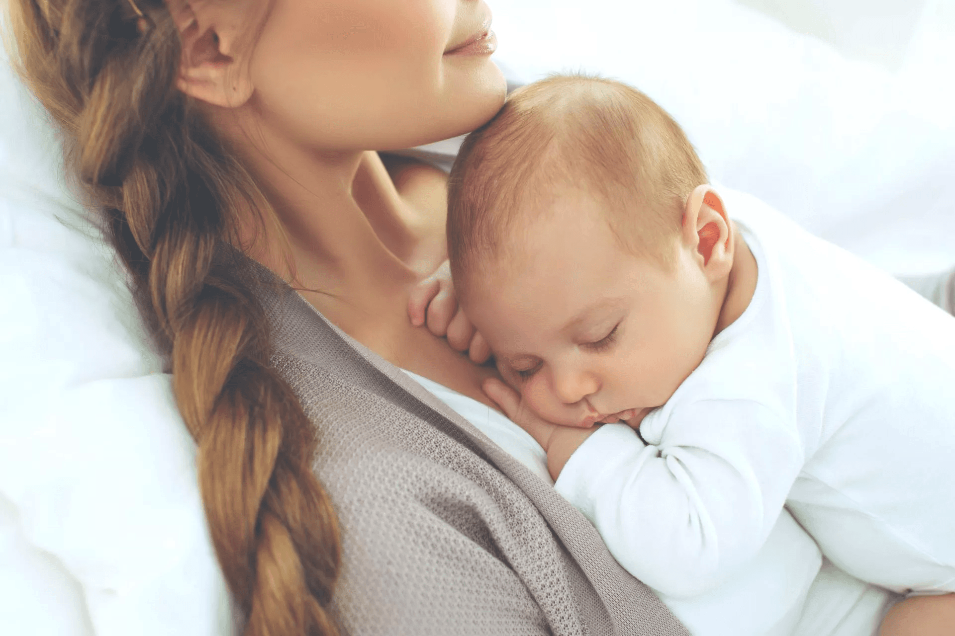 Mother holding a sleeping baby